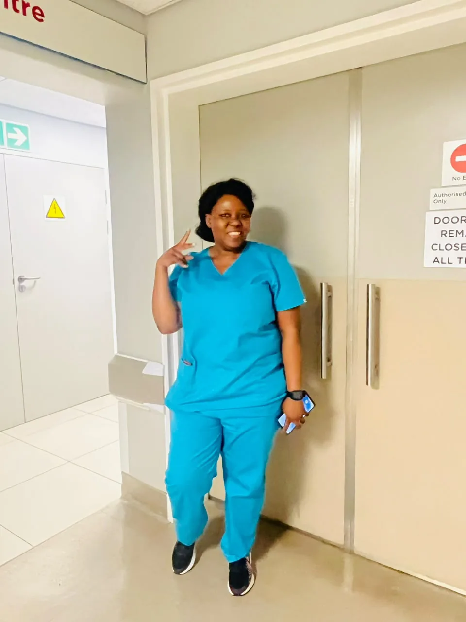 A Caring Hearts caregiver in scrubs