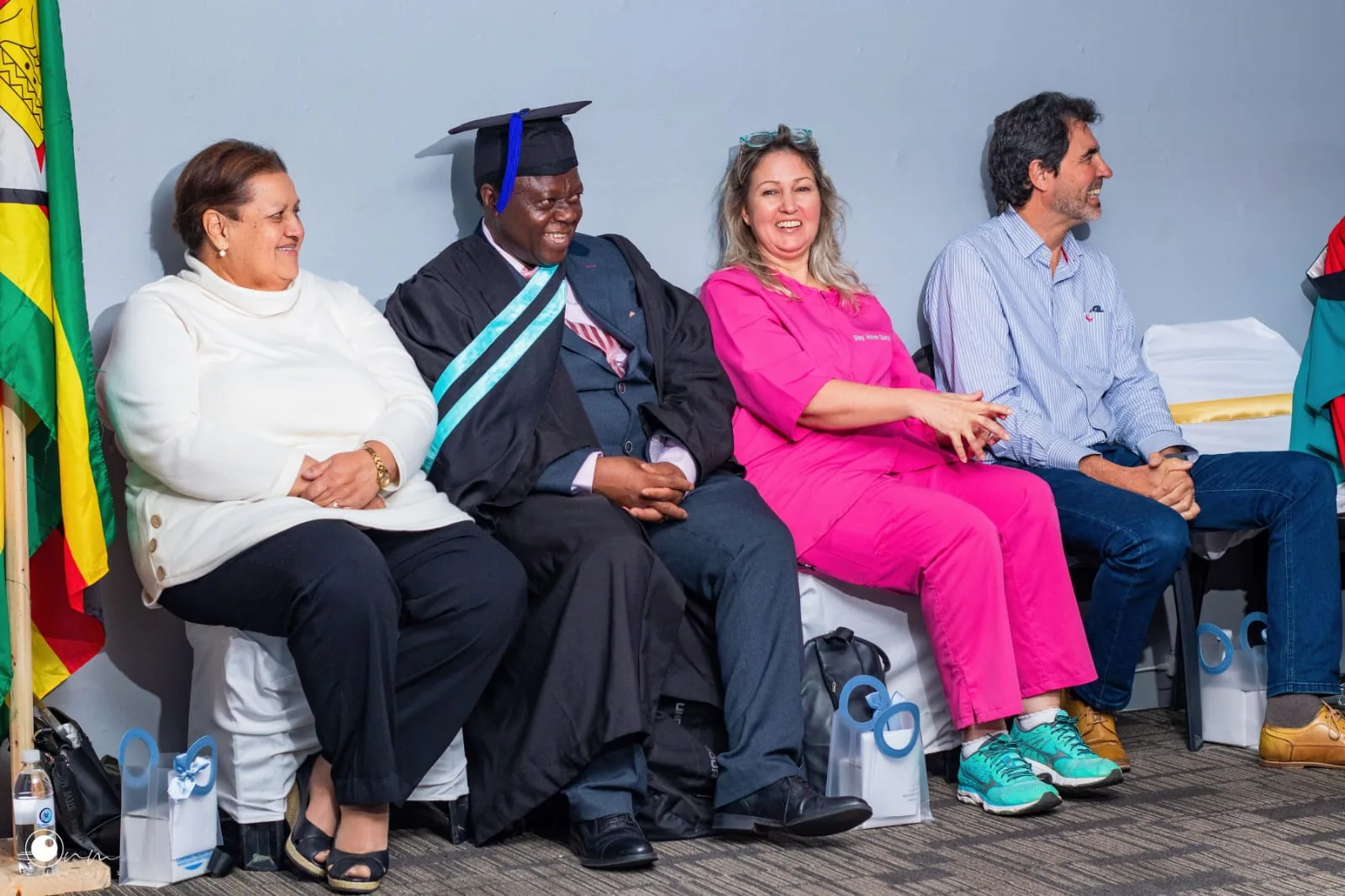 Guests sharing a laugh at the ceremony